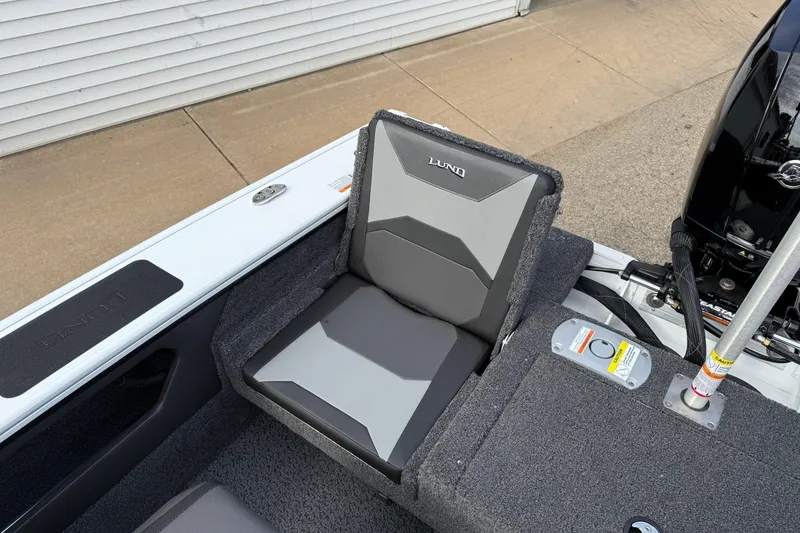 Slide: The Image of 2026 Lund 1875 Crossover XS boat seat with gray upholstery and sleek design. - 35