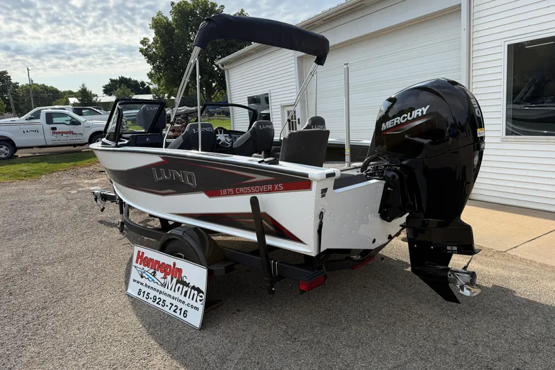 Slide: The Image of 2026 Lund 1875 Crossover XS boat with Mercury engine at Hennepin Marine dealership. - 8