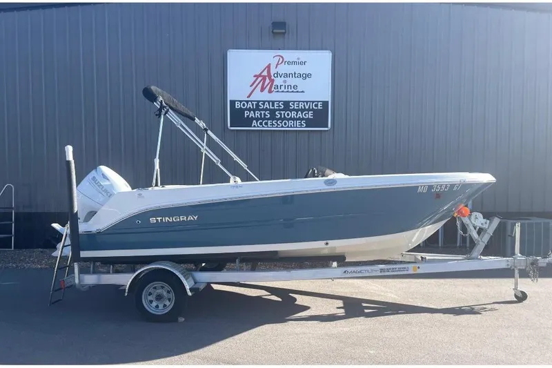 Slide: The Image of 2021 Stingray 172 SC boat on trailer at Premier Advantage Marine dealership. - 0