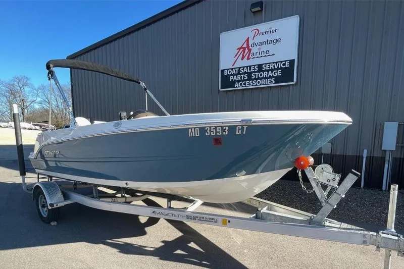 Slide: The Image of 2021 Stingray 172 SC boat on trailer at Premier Advantage Marine dealership. - 1