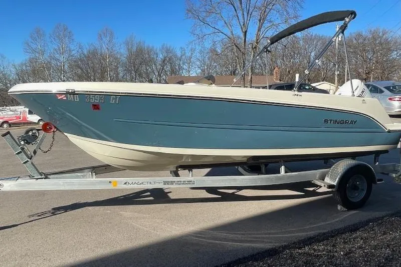 Slide: The Image of 2021 Stingray 172 SC boat on trailer, parked outdoors on a sunny day. - 11