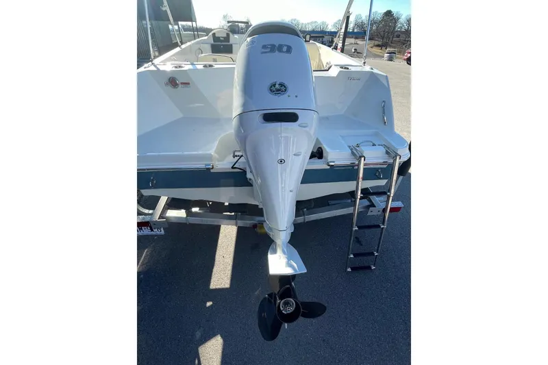 Slide: The Image of 2021 Stingray 172 SC boat with outboard motor and ladder, rear view. - 4