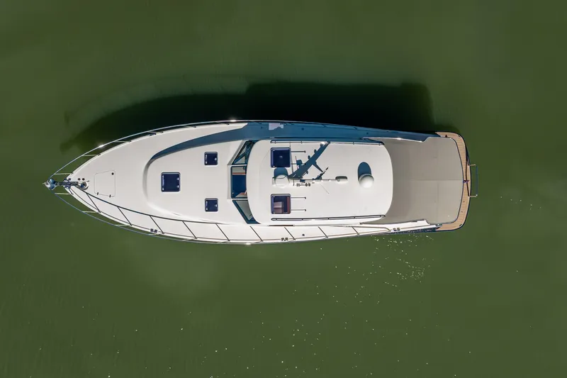 Slide: The Image of Overhead view of 2017 Palm Beach Motor Yachts PB45 on calm green water. - 18