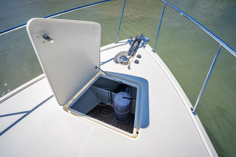 Slide: The Image of 2017 Palm Beach Motor Yachts PB45 deck with open hatch and anchor equipment. - 19