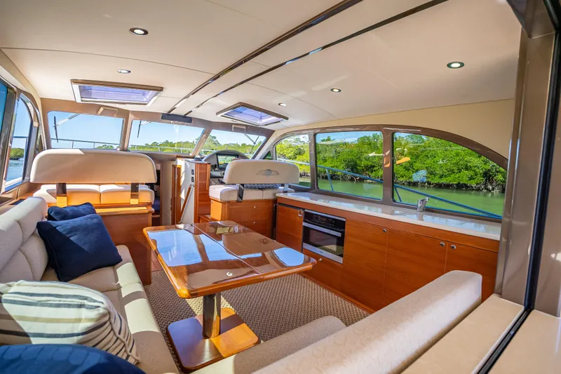 Slide: The Image of Luxurious interior of 2017 Palm Beach Motor Yachts PB45 with elegant seating and panoramic windows. - 2