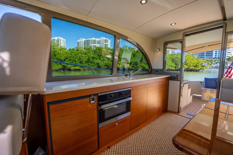 Slide: The Image of Luxurious interior of 2017 Palm Beach Motor Yachts PB45 with scenic waterfront view. - 25