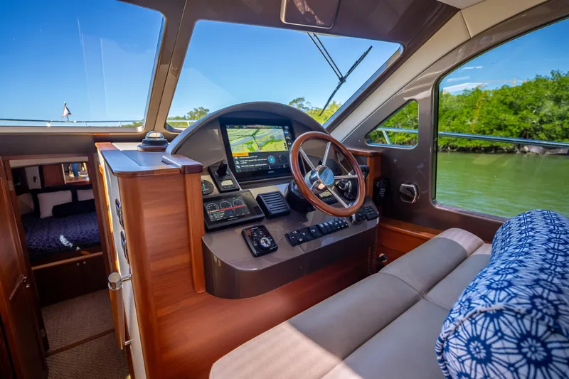 Slide: The Image of 2017 Palm Beach Motor Yachts PB45 interior helm with navigation system and luxurious seating. - 31