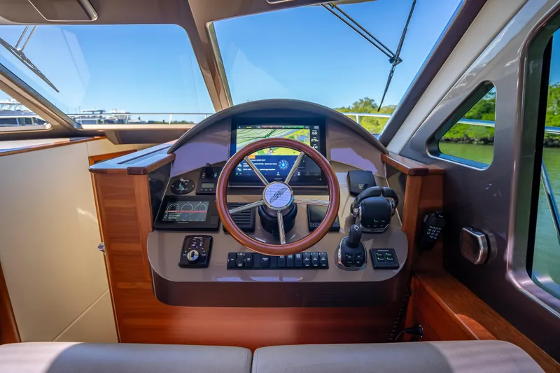 Slide: The Image of Helm of 2017 Palm Beach Motor Yachts PB45 with modern navigation controls. - 33