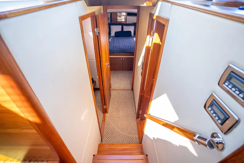 Slide: The Image of Luxurious interior of 2017 Palm Beach Motor Yachts PB45, featuring elegant wood finishes. - 37