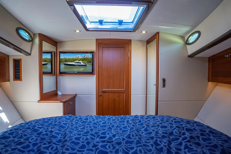 Slide: The Image of Luxurious 2017 Palm Beach Motor Yachts PB45 cabin interior with elegant wood finishes. - 40