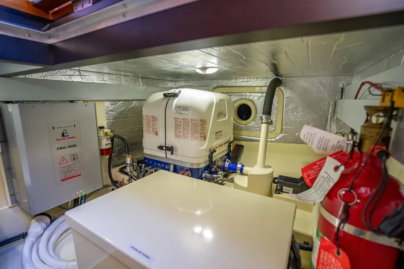 Slide: The Image of Engine room of 2017 Palm Beach Motor Yachts PB45 with generator and fire extinguisher. - 53