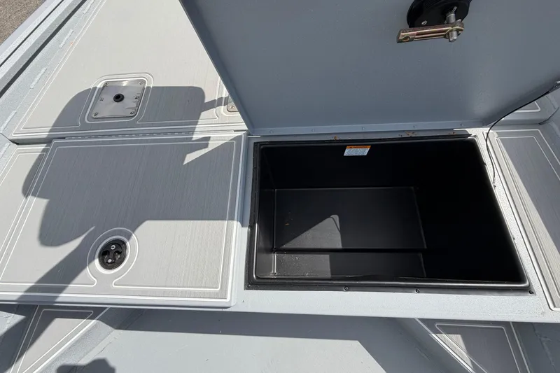 Slide: The Image of 2026 G3 Bay 20 boat interior with white seating and steering console. - 4