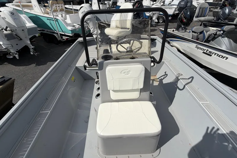 Slide: The Image of 2026 G3 Bay 20 boat interior with steering console and seating. - 5