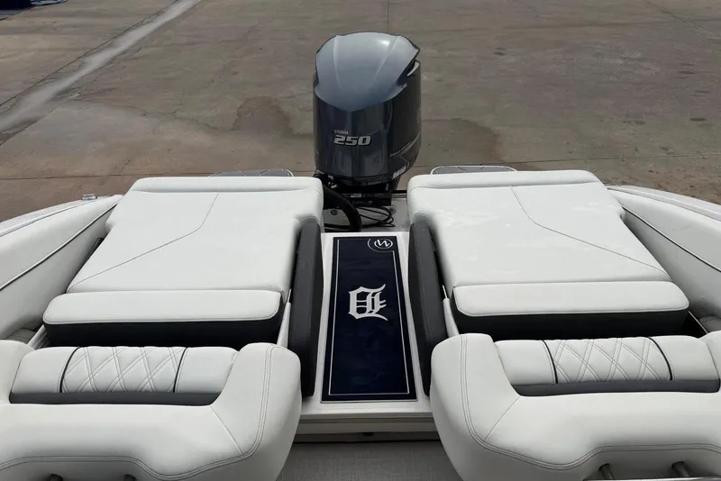 Slide: The Image of 2023 Regal LX4 boat with Yamaha 250 engine, featuring luxurious white seating. - 16