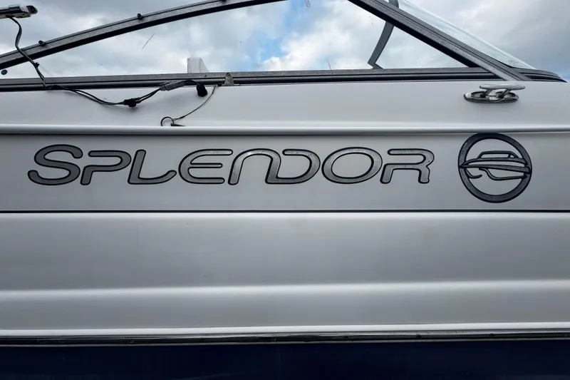 Slide: The Image of 2008 Splendor 240 Sunstar boat side view with logo and emblem. - 15