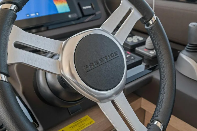 Slide: The Image of Steering wheel of 2022 Prestige 520 yacht, featuring sleek design and modern controls. - 19