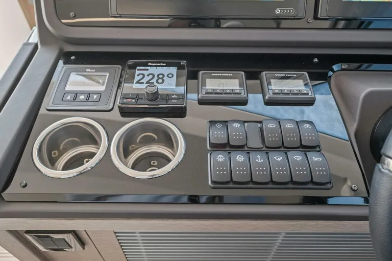 Slide: The Image of Control panel of 2022 Prestige 520 yacht with navigation and system switches. - 20