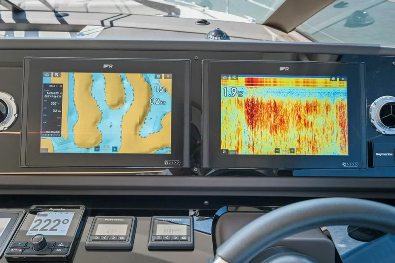 Slide: The Image of Dashboard of a 2022 Prestige 520 yacht with navigation and sonar displays. - 21