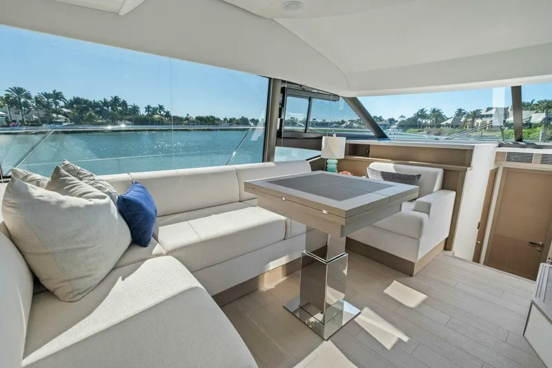 Slide: The Image of Luxurious interior of 2022 Prestige 520 yacht with elegant seating and scenic water view. - 24
