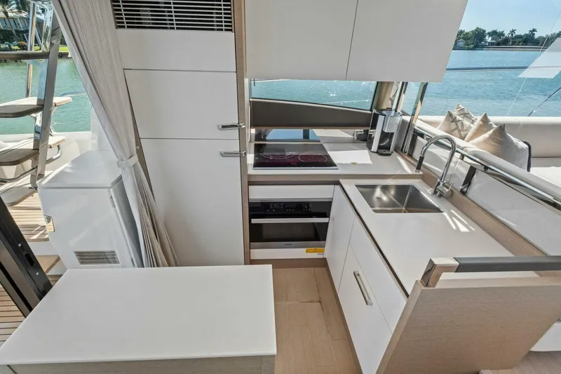 Slide: The Image of Modern kitchen interior on 2022 Prestige 520 yacht with sleek design and waterfront view. - 27