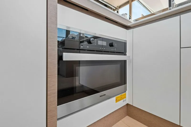 Slide: The Image of Modern kitchen with Miele oven in Prestige 520, 2022 model yacht. - 28