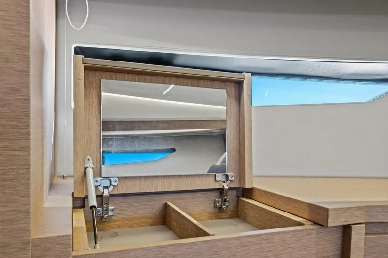 Slide: The Image of Luxury interior of 2022 Prestige 520 yacht with wooden vanity and mirror. - 35