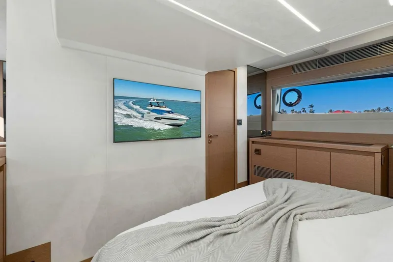 Slide: The Image of Luxurious 2022 Prestige 520 yacht interior with modern bedroom and ocean view. - 41