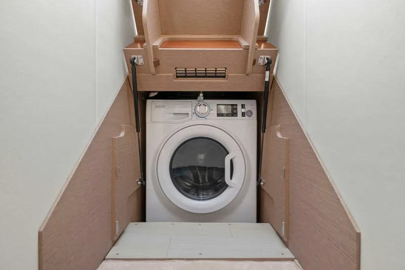 Slide: The Image of Washing machine in a 2022 Prestige 520 yacht interior compartment. - 46