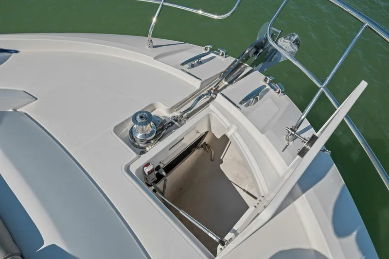 Slide: The Image of Bow of 2022 Prestige 520 yacht with anchor locker and winch system. - 60