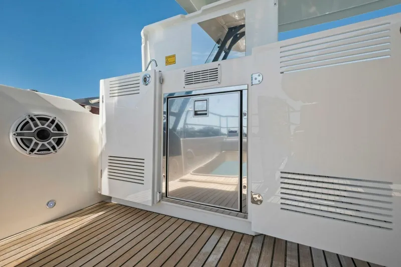 Slide: The Image of Luxury yacht deck with sleek design, featuring Prestige 520 model, 2022. - 73