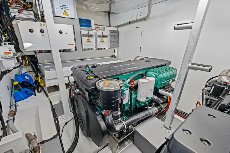 Slide: The Image of Engine room of 2022 Prestige 520 yacht with modern equipment and wiring. - 78