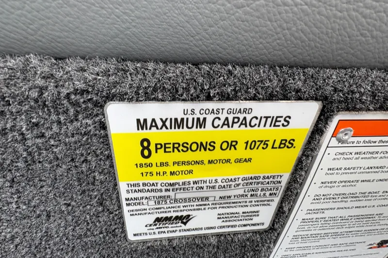 Slide: The Image of 2026 Lund 1875 Crossover XS capacity label, 8 persons or 1075 lbs, 175 HP motor. - 30