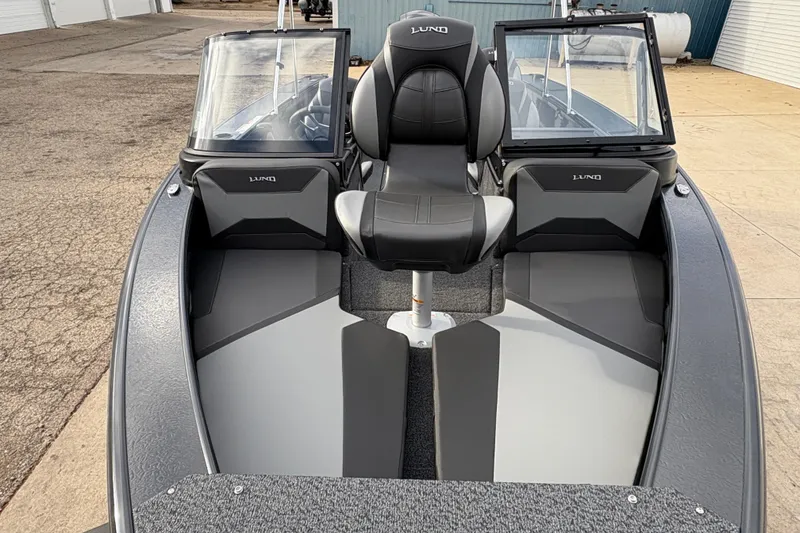 Slide: The Image of 2026 Lund 1875 Crossover XS boat interior with dual windshields and seating. - 9