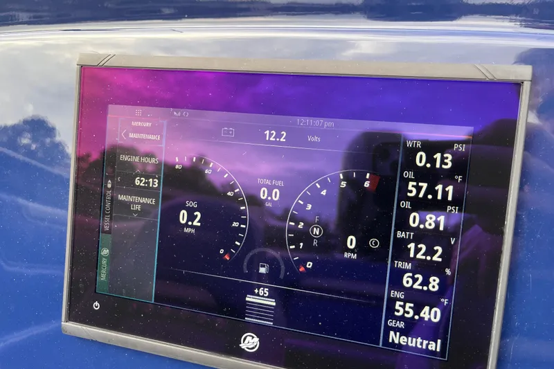 Slide: The Image of Digital dashboard display of a 2023 Tuff 20 boat showing engine metrics and maintenance data. - 12