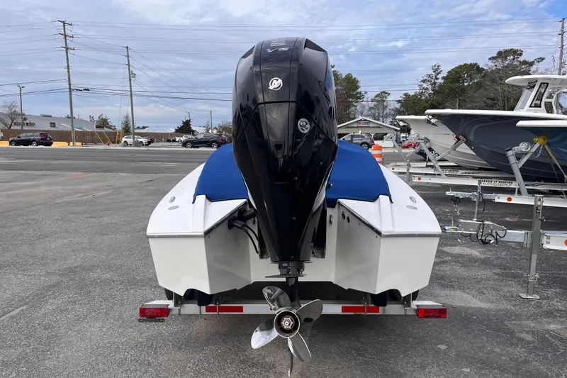 Slide: The Image of 2023 Tuff 20 boat with powerful outboard motor on trailer in parking lot. - 5