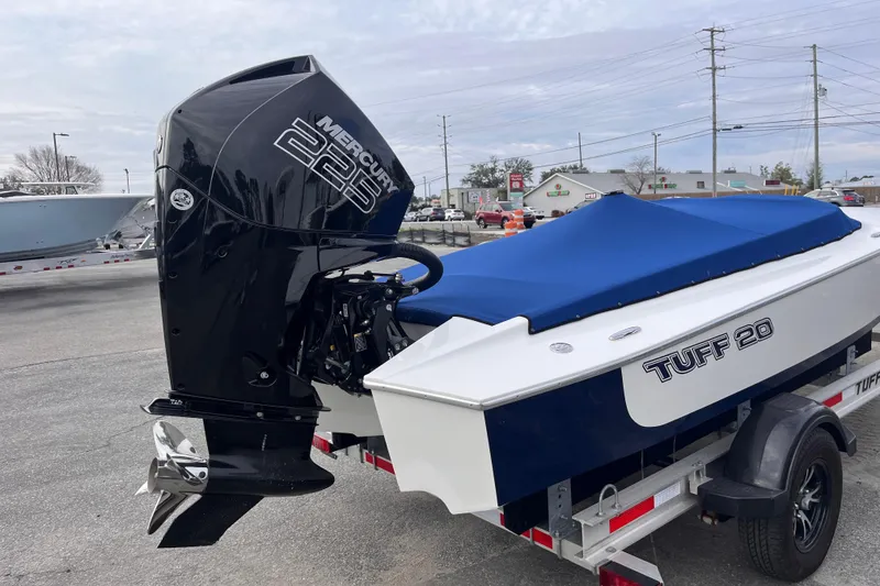 Slide: The Image of 2023 Tuff 20 boat with Mercury 225 engine, blue cover, on trailer. - 6