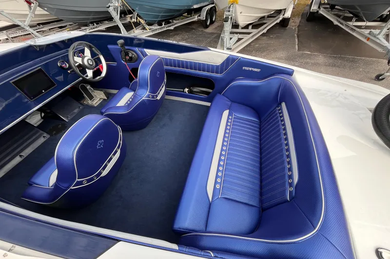 Slide: The Image of Luxurious interior of 2023 Tuff 20 boat with blue leather seating and modern dashboard. - 8