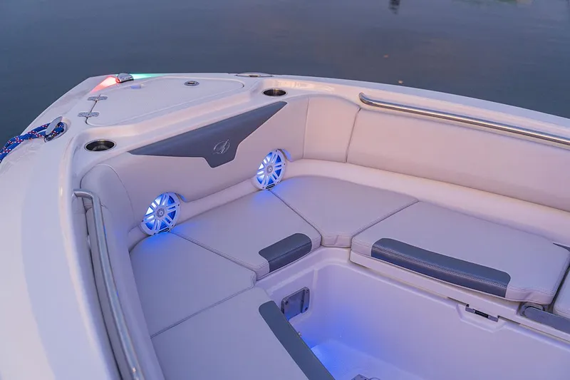 Slide: The Image of Manufacturer Provided Image: 2026 Sailfish 232 CC boat interior with cushioned seating and blue LED lighting. - 8
