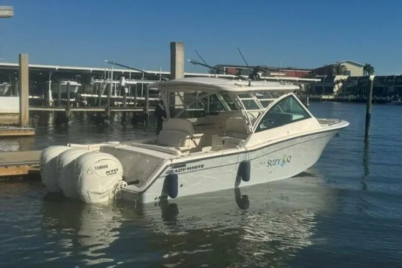 Slide: The Image of 2025 Grady-White Freedom 375 boat docked, featuring Yamaha XTO engines. - 15