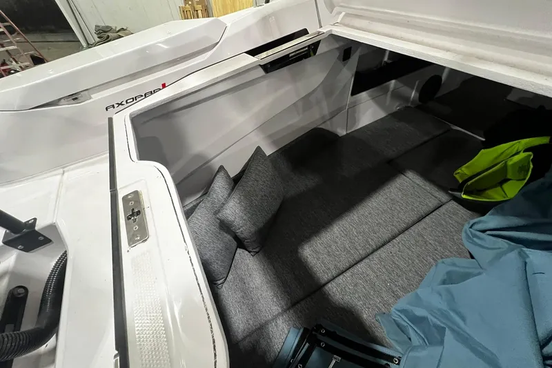 Slide: The Image of 2025 Axopar 29 XC Cross Cabin interior with cushions and storage space. - 23