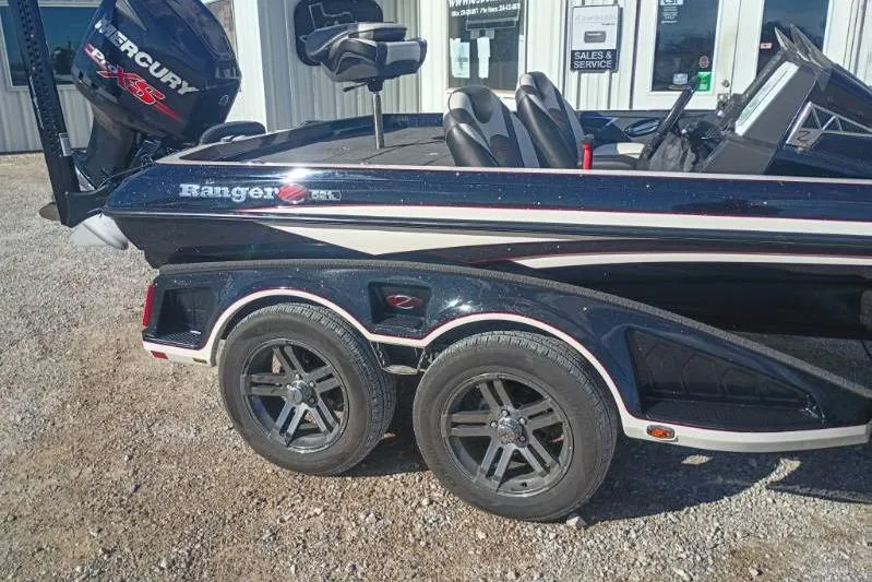 Slide: The Image of 2018 Ranger Z521L boat with Mercury engine, parked outside sales and service center. - 5