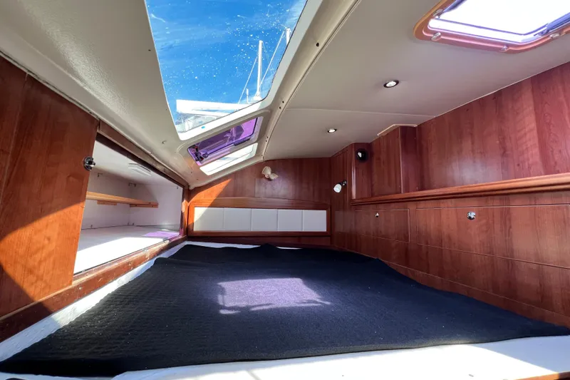 Slide: The Image of Interior of 2013 Gemini Legacy 35 sailboat with wood paneling and skylight. - 10