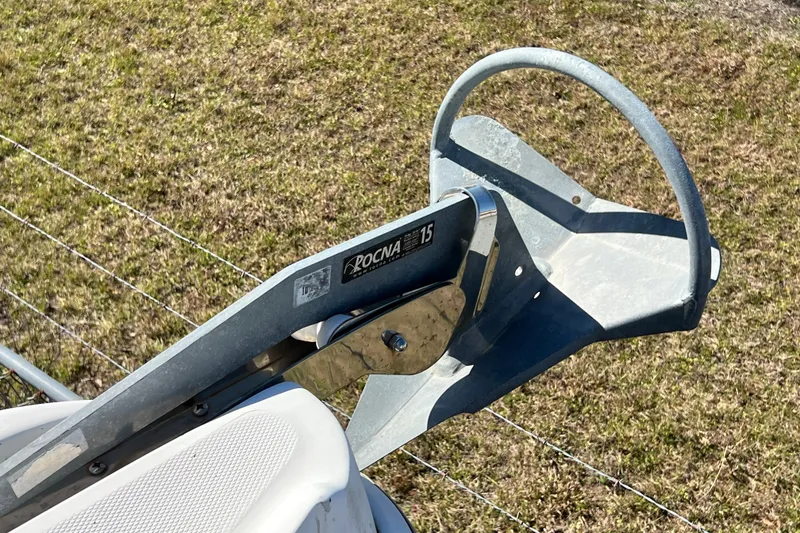 Slide: The Image of Rocna 15 anchor on Gemini Legacy 35, 2013 model, resting on grassy surface. - 104