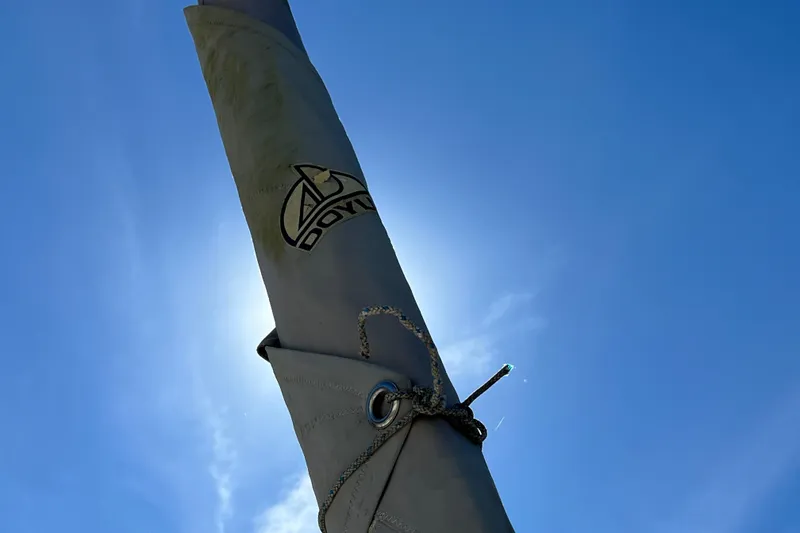 Slide: The Image of Sail of Gemini Legacy 35, 2013 model, against a clear blue sky. - 107