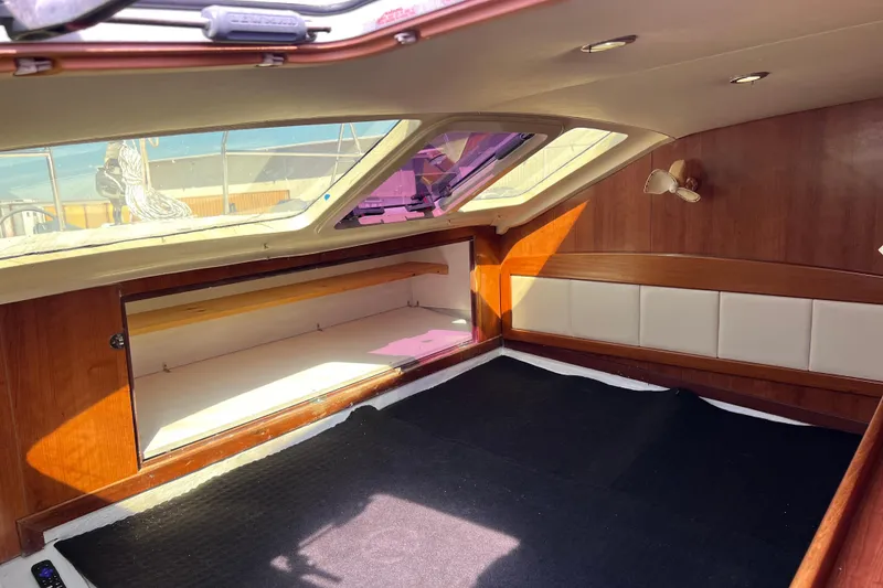 Slide: The Image of Interior cabin of 2013 Gemini Legacy 35 sailboat with wood and white accents. - 11