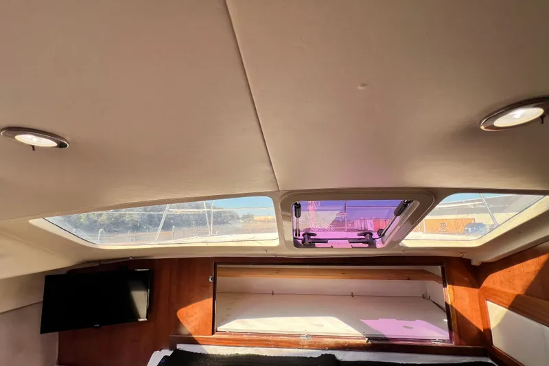 Slide: The Image of Interior of 2013 Gemini Legacy 35 yacht with skylight and TV. - 12