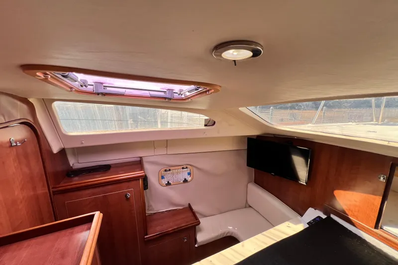 Slide: The Image of Interior of 2013 Gemini Legacy 35 sailboat with wood finish and natural light. - 13