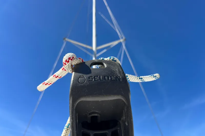 Slide: The Image of Close-up of a Selden sailboat rigging on a 2013 Gemini Legacy 35 under clear blue sky. - 132