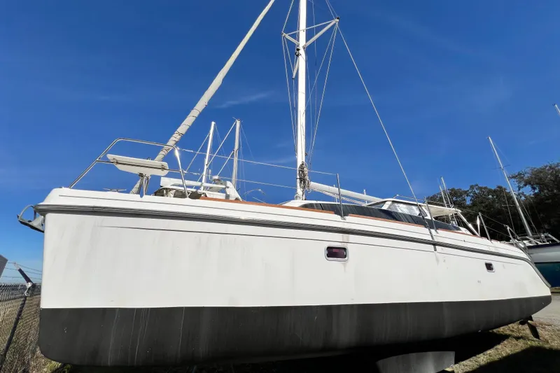 Slide: The Image of 2013 Gemini Legacy 35 sailboat on land under clear blue sky. - 141