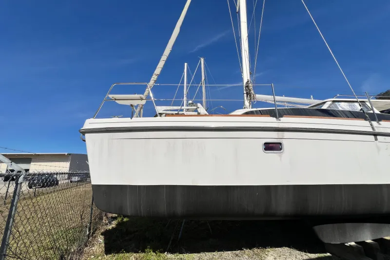 Slide: The Image of 2013 Gemini Legacy 35 sailboat on land, clear blue sky background. - 142